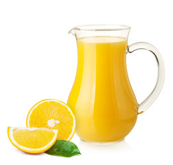 Orange juice in pitcher and oranges