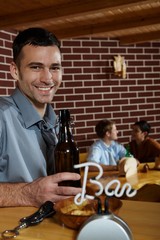 Portrait of young man in pub