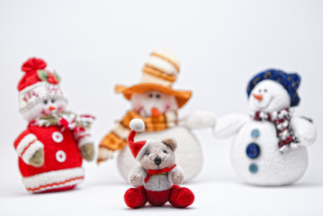 Christmas Teddy and three Snowmen on a white background.