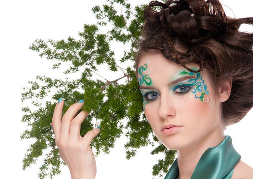 Close-up of sprite girl with faceart and plant