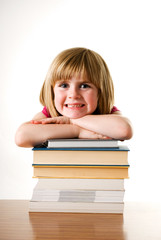 child girl leaning on books