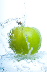 Fototapeta na wymiar apple into water splash
