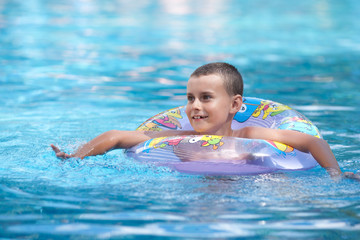 Fototapeta na wymiar Little boy in a pool
