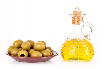 Olives and a bootle of oil isolated on white