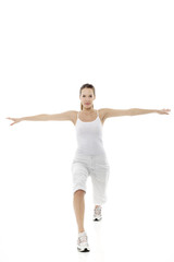 Young woman doing gymnastics on white background studio