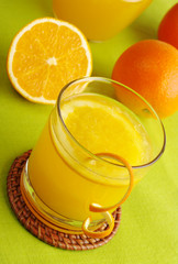 Fresh orange juice with orange slice in glass (Selective Focus)