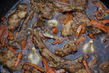 cooking pilaf in a cast iron cauldron over a fire