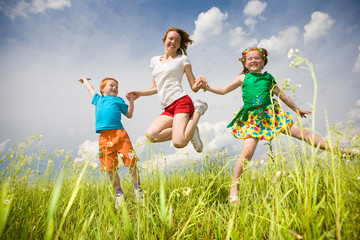 Mother with children Having Fun in the field. Foces on eyes.