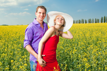 Young love Couple smiling under blue sky