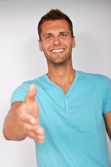 Fototapeta premium Young attractive man and his handshake