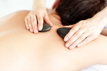 Close-up of a man with hot stone on his back