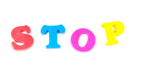 stop written in fridge magnets