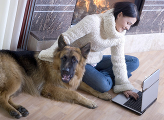 Attractive woman rests at fireplace