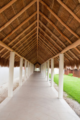 Long Walkway Under Straw Thatched Roof