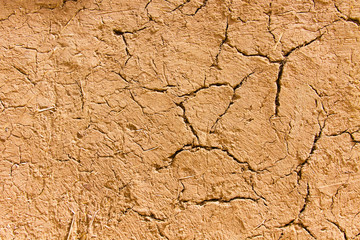 Old cracked wall made of clay