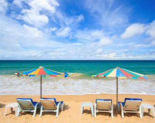 Fototapeta na wymiar Colorful Umbrella and chair on the beach in Summer