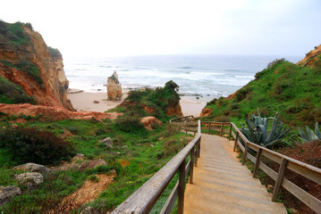 Fototapeta na wymiar Wooden steps to Praia da Vau, Algarve, Portugal