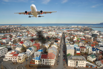Airplane above Reykjavik city - obrazy, fototapety, plakaty