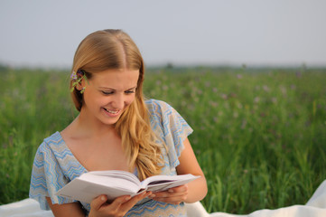 girl sitting on green grass