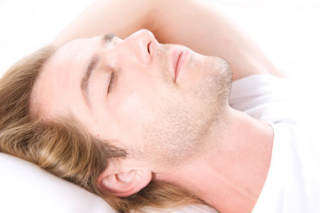 Obraz na płótnie Canvas Handsome Man Sleeping in his Bed