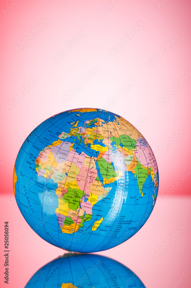 Wall mural globalisation concept - globe against gradient colorful backgrou