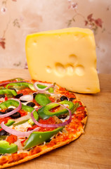 Pizza with vegetables and pepperoni