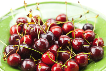Cherries in a plate isolated on white