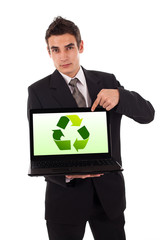 Business man pointing at a laptop with recycle sign