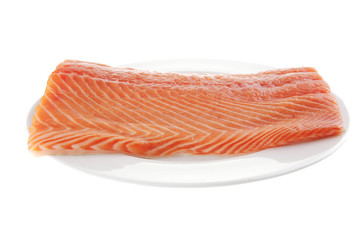 big salmon fillet on white plate