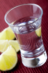 shot glass filled with clear cold alcohol