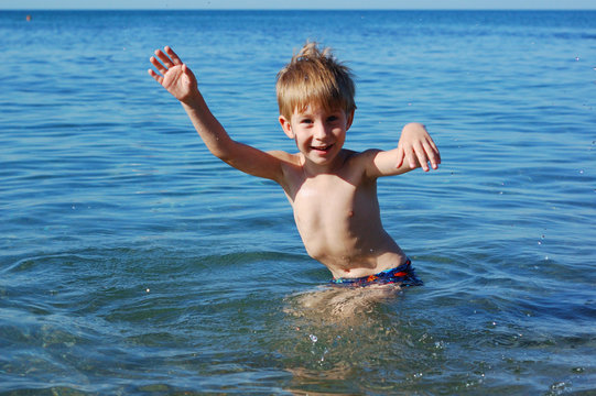 happy boy swimming
