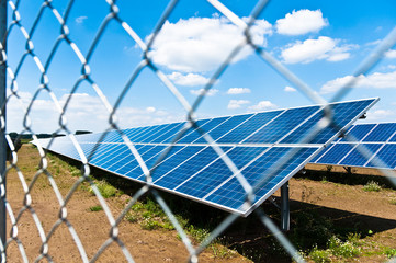 Solar panels behind fence