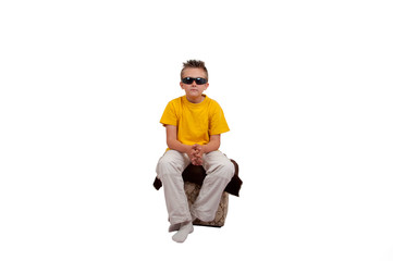 boy with sunglasses sit, isolated on white background