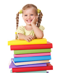 Child holding pile of books.