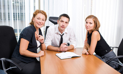 Manager with office workers on meeting