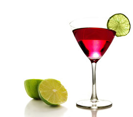 Martini glass with a slice of lime on white background