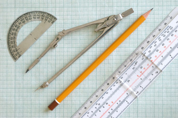 Compasses, pencil, protractor and slide rule