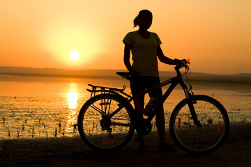 Girl with bicycle.