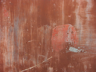 worn painted red metal surface  with scratches and dirt