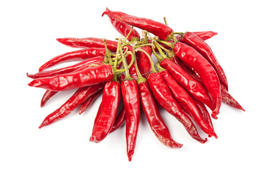A string with a bunch of red chilli peppers isolated on white ba