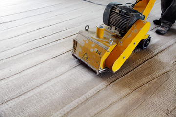 machine removing the surface of a concrete floor