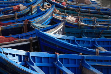 Fototapeta na wymiar Blue wooden fishing boats at the harbour