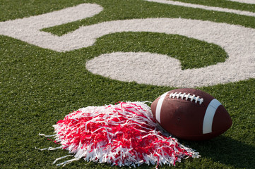 American Football and Pom Poms on Field - 25093670