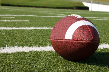 Closeup of American Football on Field