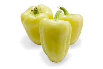 three yellow peppers isolated on white with digitally added shad