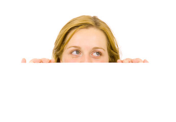 Portrait of a beautiful blond woman holding a blank billboard