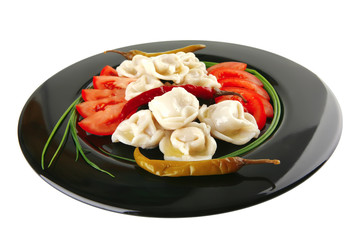 dumplings served on black plate