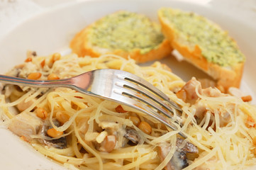 spaghetti with mushroom sauce and cedar nuts