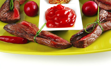 meat slices on green