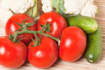 Vegetables, tomatoes, cucumbers, cauliflower on a table